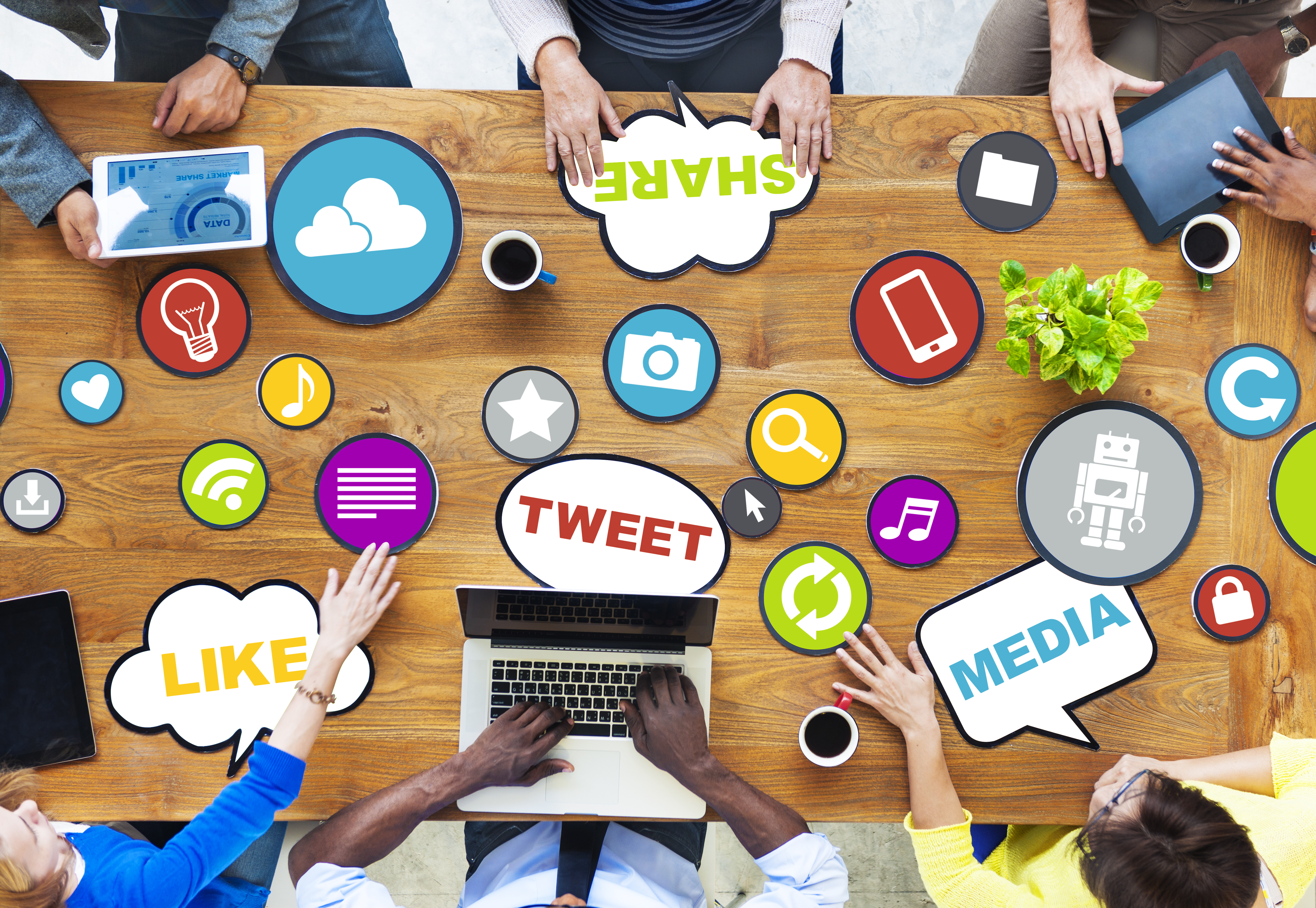 Social media icons scattered on table